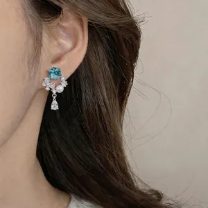 Elegant silver needle stud earrings with blue gemstone pearl and teardrop crystal