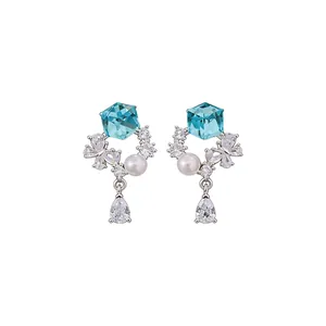 Elegant minimalist silver needle drop earrings with blue crystal cube and white pearls