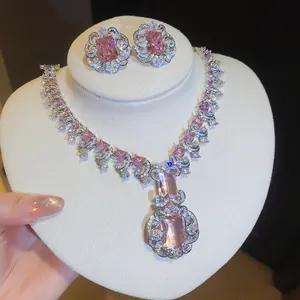 Close-up of luxury pink square zircon necklace and earrings jewelry set for banquet