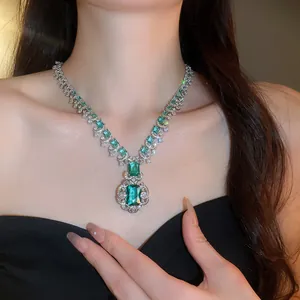 Detailed view of luxury emerald green square zircon necklace with floral lace design