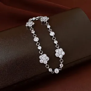 Elegant silver-tone camellia flower bracelet featuring sparkling moissanite and zircon stones