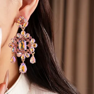 Luxurious palace style drop earrings with iridescent crystals and floral gold setting.