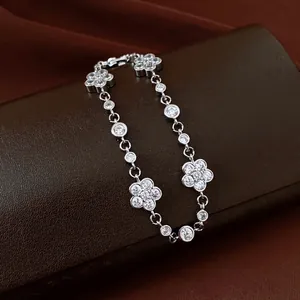 Close-up of elegant camellia flower bracelet with sparkling moissanite stones