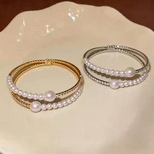 Elegant double-layer bracelet with pearls and rhinestones in gold and silver