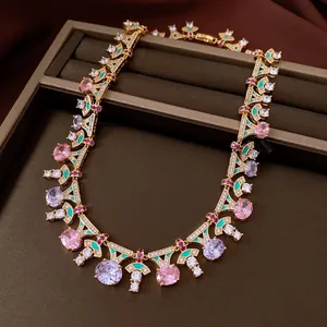 Close-up of vintage multi-color zircon necklace with enamel detailing and gold finish