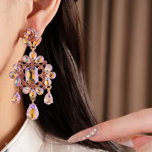 Exquisite close-up detail of luxury court style dangling earrings with aurora crystals