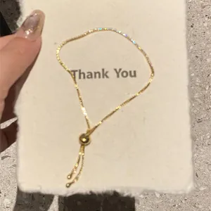 Elegant 18k gold plated geometric zircon bracelet shown on a textured card detail