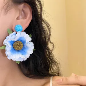 Handmade raffia flower stud earrings with blue and white gradient petals for women