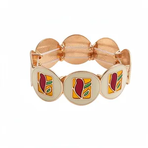 Élégant bracelet extensible en or rose avec breloques circulaires aux motifs floraux en émail