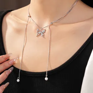 Elegant silver butterfly pendant necklace with dangling pearl tassel details for women
