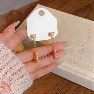 Elegant gold-plated tassel earrings with zircon studs for a minimalist fashion look.