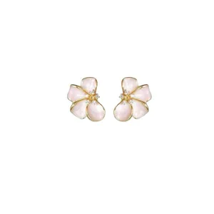 Elegant floral stud earrings with pink enamel petals and crystal centers in gold finish