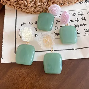 Elegant Neo-Chinese resin flower earrings featuring vintage green square resin drops
