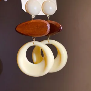 Vintage minimalist resin and wood geometric dangle earrings with cream ring pendants