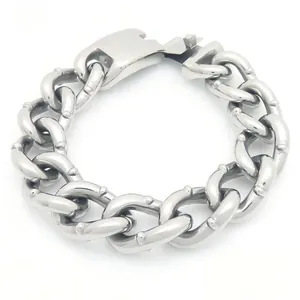 Heavy 18mm Cuban link bracelet with rivet studs, crafted from solid stainless steel.