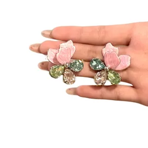 Exaggerated colorful rhinestone flower stud earrings with pink enamel petals and crystals