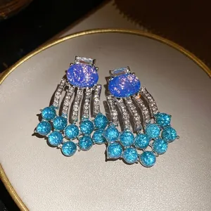 Elegant vintage style blue resin tassel earrings featuring sparkly clear rhinestones