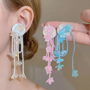 Vibrant flower beaded tassel earrings in multiple colors for a playful summer look