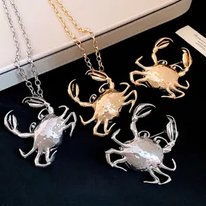 Creative 3D crab pendant necklace and brooch set with a high-shine metallic finish
