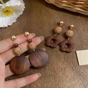 Elegant retro handmade wooden flower and round drop earrings with natural straw beads