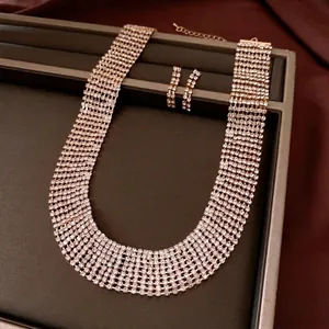 Luxurious multi-row rhinestone fringe necklace and earring set in a vintage palace style.
