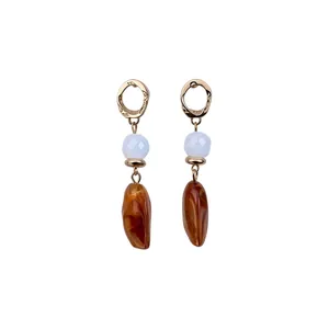 Vintage irregular geometric drop earrings featuring light blue beads and amber resin pendants.