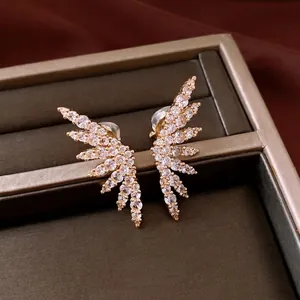 Elegant 18k gold plated wing shaped ear clips encrusted with sparkling white zircons