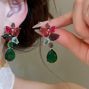 Close-up of luxury colorful ice-crack zircon earrings featuring mixed stone shapes.