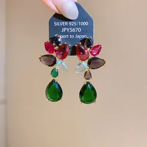 Detailed view of heavy-duty multi-colored cubic zirconia drop earrings for banquet events