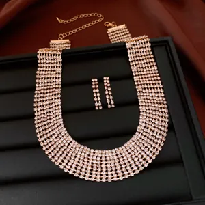 Detailed view of a luxury rhinestone choker necklace and matching long tassel earrings