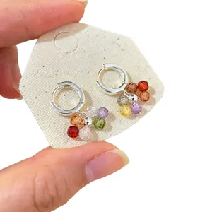 Silver hoop earrings with colorful faceted bead charms in a vibrant dopamine style.