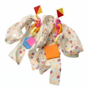 Colorful geometric resin earrings with printed ribbon bows and chain links