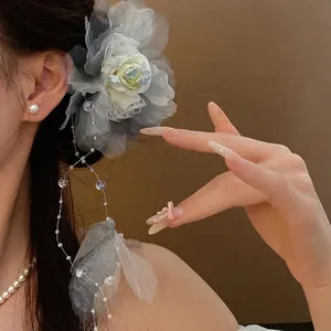 Elegant floral hair clip with pearl tassels and blue organza petals for stylish women