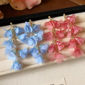 Detailed view of handmade blue and pink chiffon flower tassel drop earrings