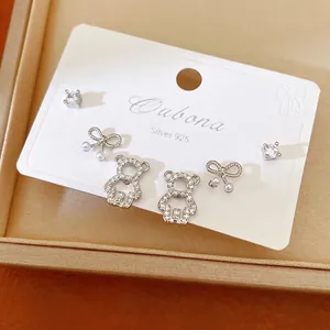 Elegant silver S925 earrings set featuring zircon bears and pearl bows.