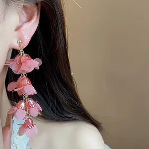 Detailed view of elegant pink chiffon flower tassel drop earrings for a romantic style