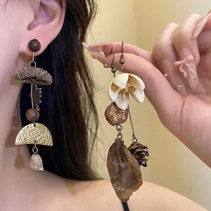 Handmade vintage wooden mushroom drop earrings featuring floral and nut elements