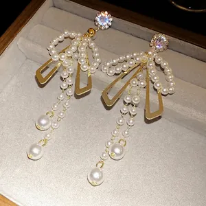 Luxury silver needle bow tassel earrings with sparkling crystals and white pearls