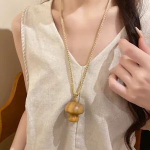 Handmade vintage wooden mushroom pendant necklace with gold woven cotton rope chain