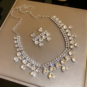 Elegant heart-shaped rhinestone necklace and earrings jewelry set in silver finish