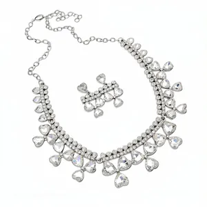 Elegant heart pendant necklace and matching earrings set with sparkling clear rhinestones