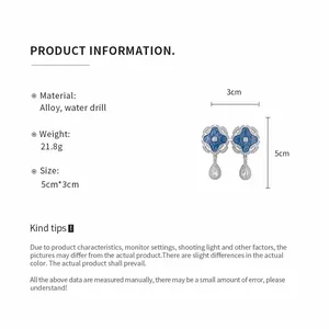 Elegant retro palace style drop earrings with blue enamel flower and crystal details