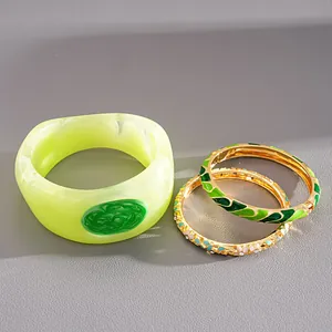 Detailed view of colorful dopamine style enamel and resin geometric bangle bracelet set