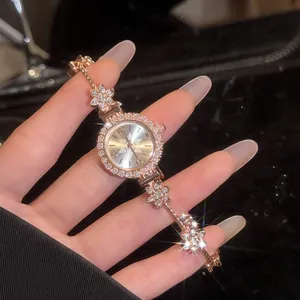 Detailed view of vintage rose gold flower watch with sparkling crystal accents