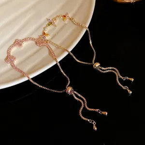 Elegant zircon clover adjustable pull-string bracelet for women in rose gold finish.