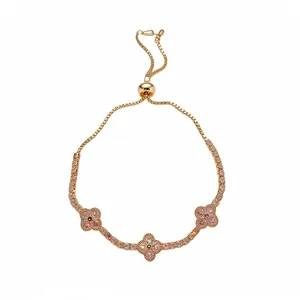 Adjustable gold clover bracelet with colorful zircon stones in pink hue