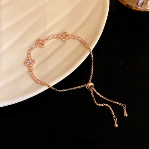 Elegant rose gold adjustable pull-style bracelet featuring pink zircon four-leaf clovers