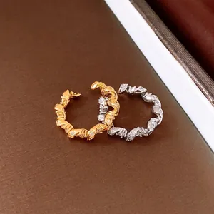 Elegant twisted zircon rings in polished gold and silver finishes for daily wear.