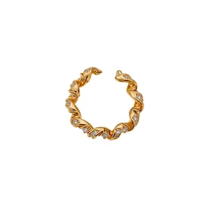 Elegant gold twisted ring with sparkling zircons, minimalist adjustable fashion jewelry