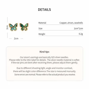 Detailed view of 18k gold plated butterfly stud earrings showing size and copper material